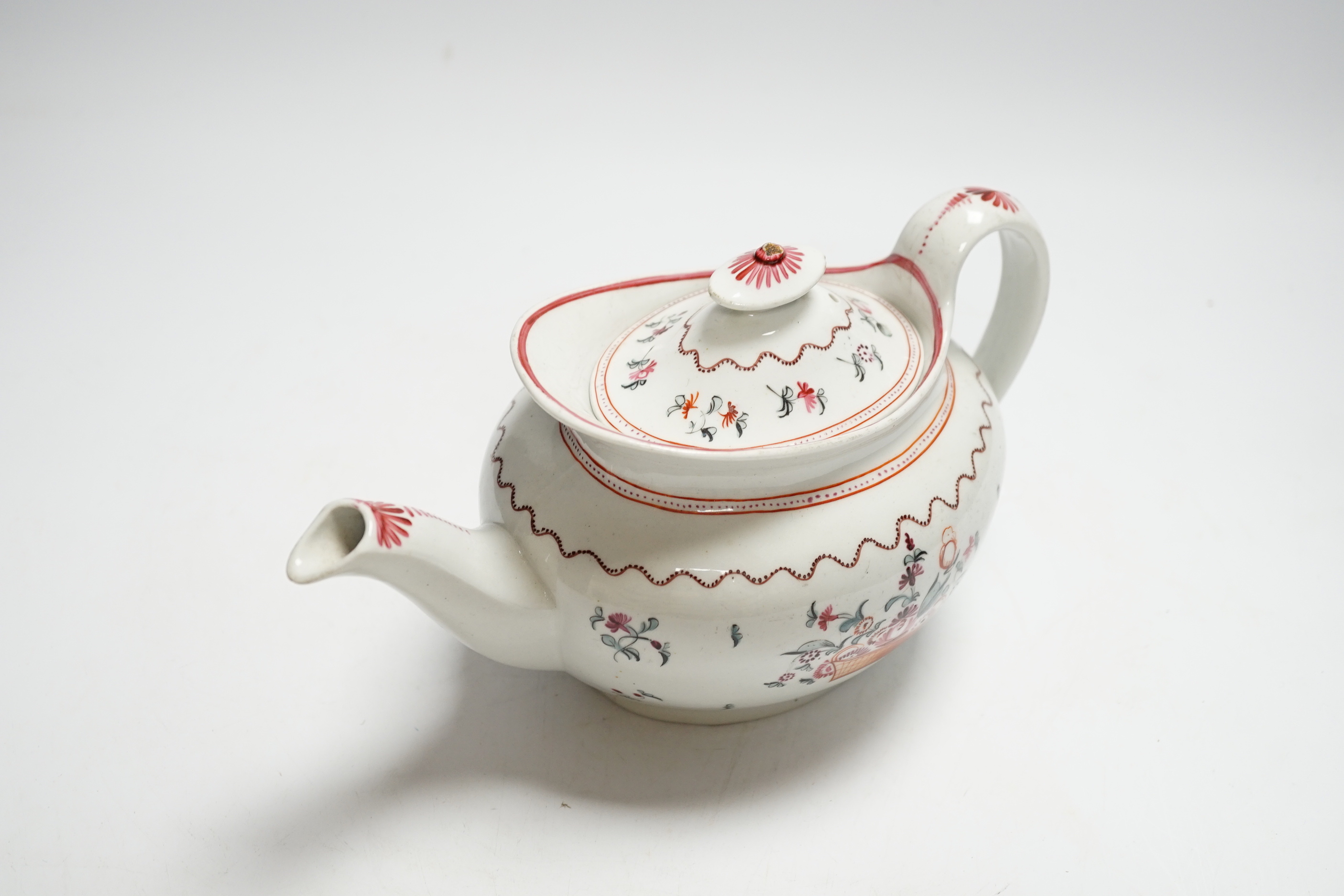 A Newhall porcelain boat shaped teapot, c.1800 with floral decoration, 25cm wide